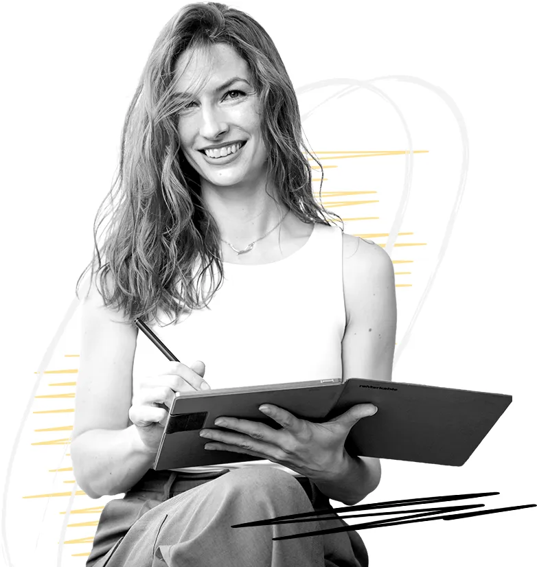 Croatian translator working on a tablet, holding a pen and smiling.
