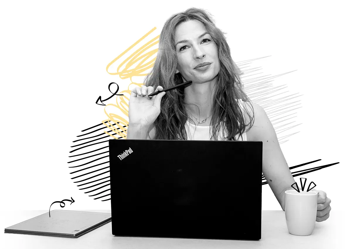 Localization specialist for the Croatian language working on a laptop, holding a coffee mug.