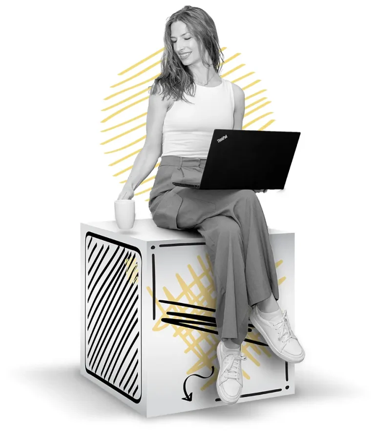 Ivana Srezović, freelance English-to-Croatian translator, sitting on a box with a laptop on her lap.